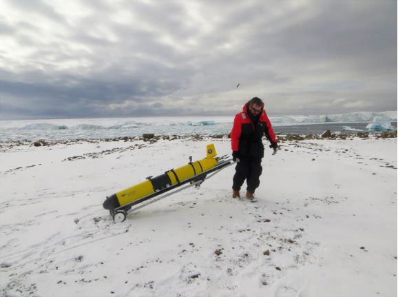 Dr Damien Guihen with an ocean glider owned by the University of California, Davis.